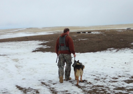 Deron with Tekoa in MOLLE Vests walking away